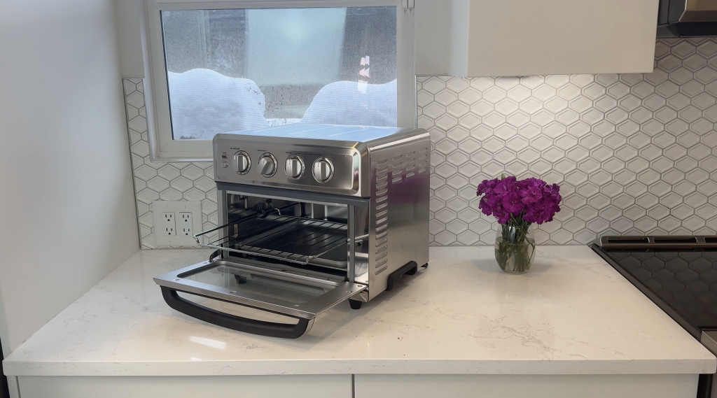 Cuisinart Air Fryer and Toaster sitting on the counter with it's front door open.
