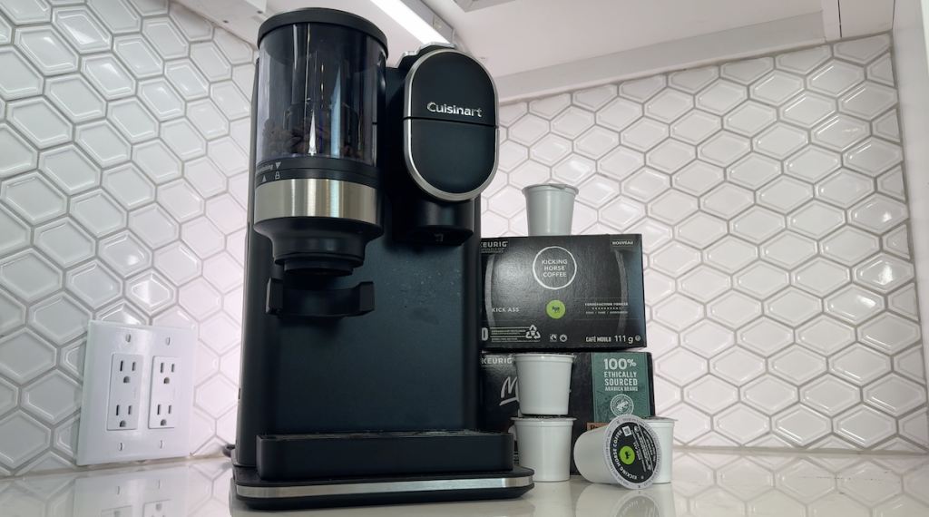 Cuisinart Grind & Brew Coffeemaker set up on the kitchen counter beside some K-cups.