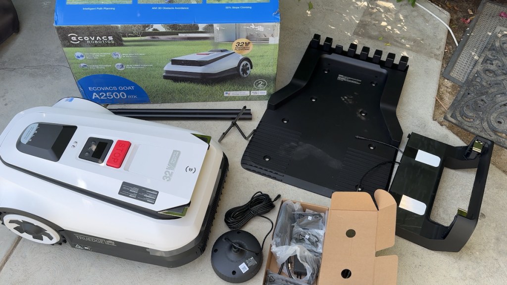 All components laid out on patio alongside original box.