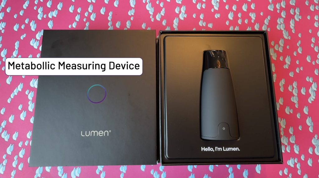 Lumen in it's box laying on a table.