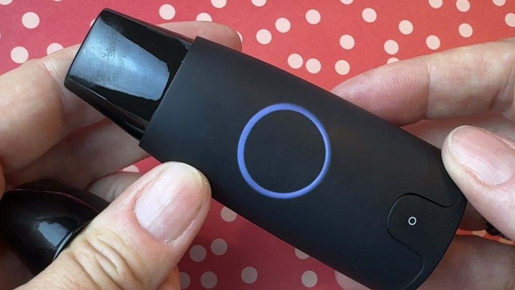 Erin's hand holding the Lumen device.