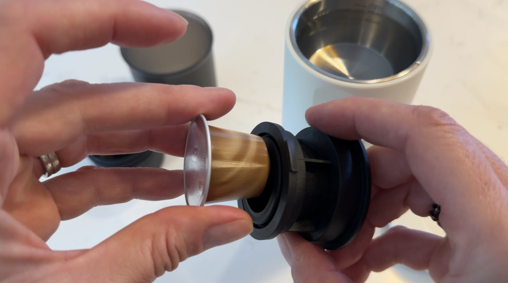 Outin Nano portable espresso machine with nespresso pod.