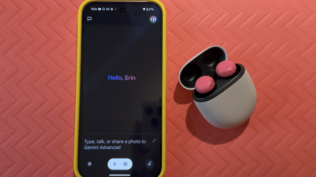 Pixel Buds Pro 2 in case beside smartphone using Google Assistant.