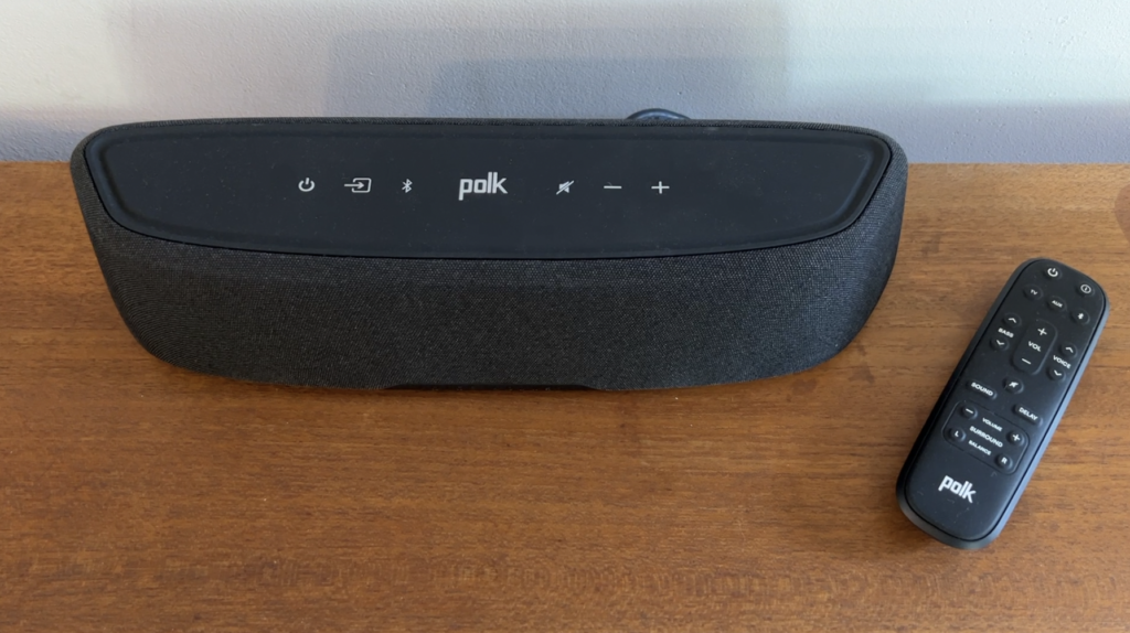 Polk Magnifi mini on teak sideboard.