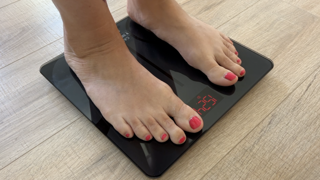 Feet standing on the renpho scale