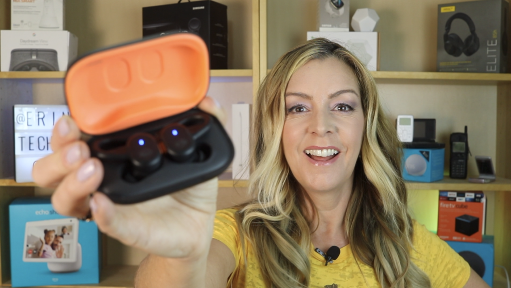Erin holding Skullcandy Push Active earbuds