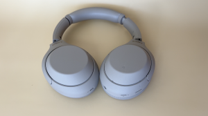 Sony 1000 XM headphones laid flat on a table.