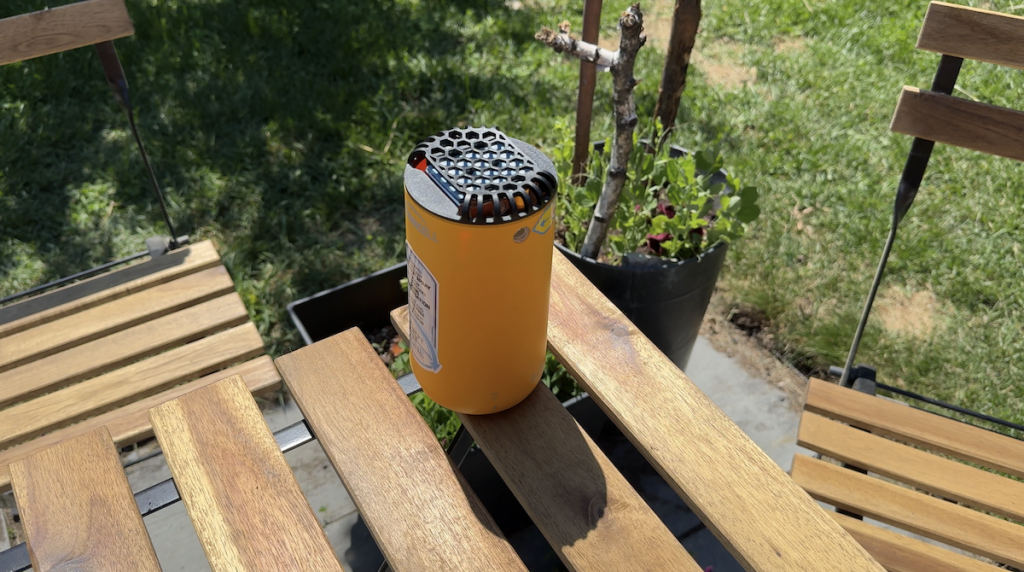 Thermacell Patio Shield sitting on a wooden table.